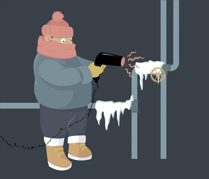 Man using a blow dryer for frozen pipes
